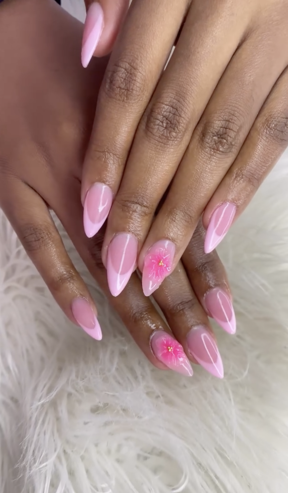 Pink French nails with pink flower nail art